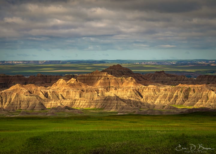 A photograph of the Sun Breaking through the Clouds at Badlands National Park