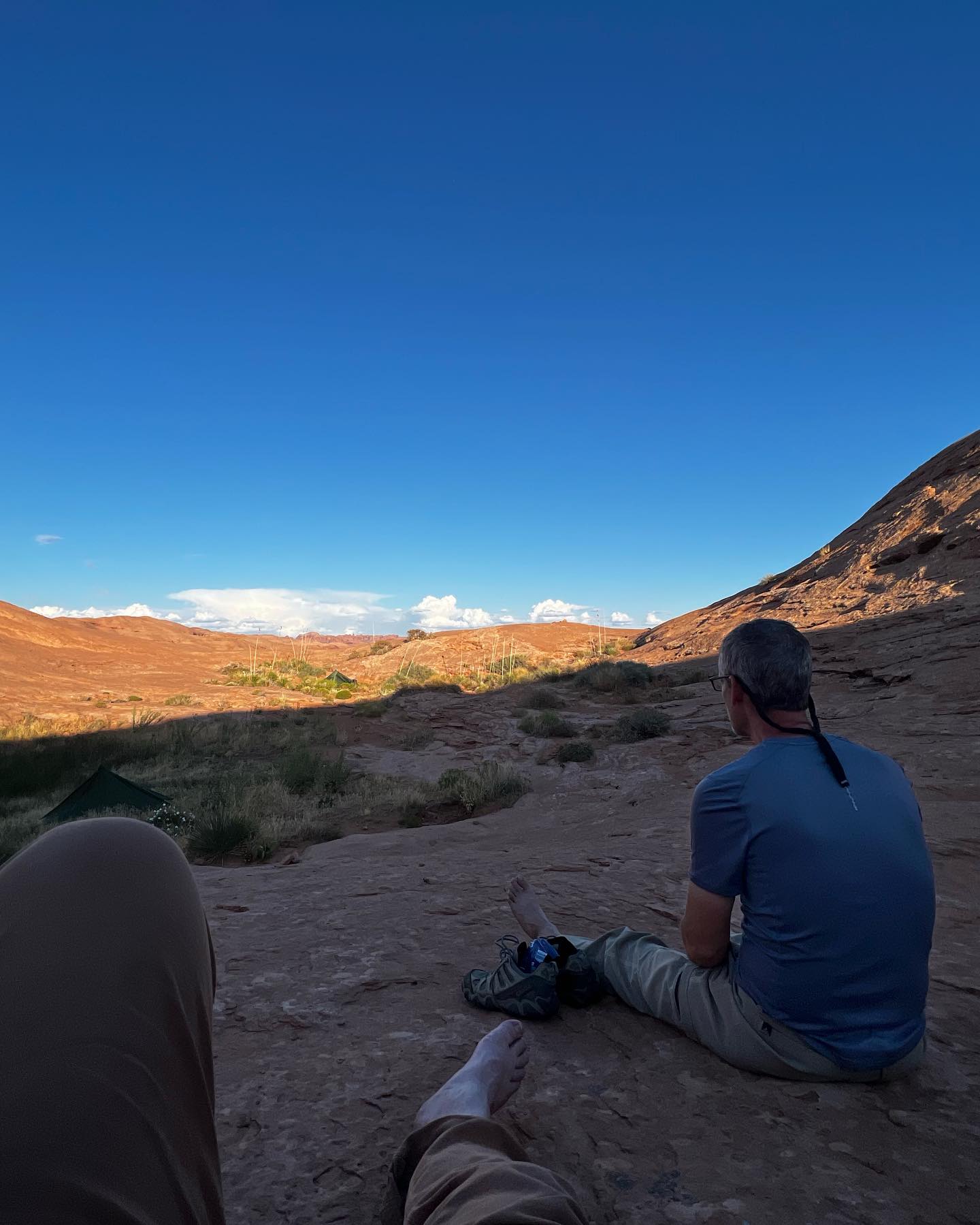 Resting on sandstone after camp at Reflection Canyon